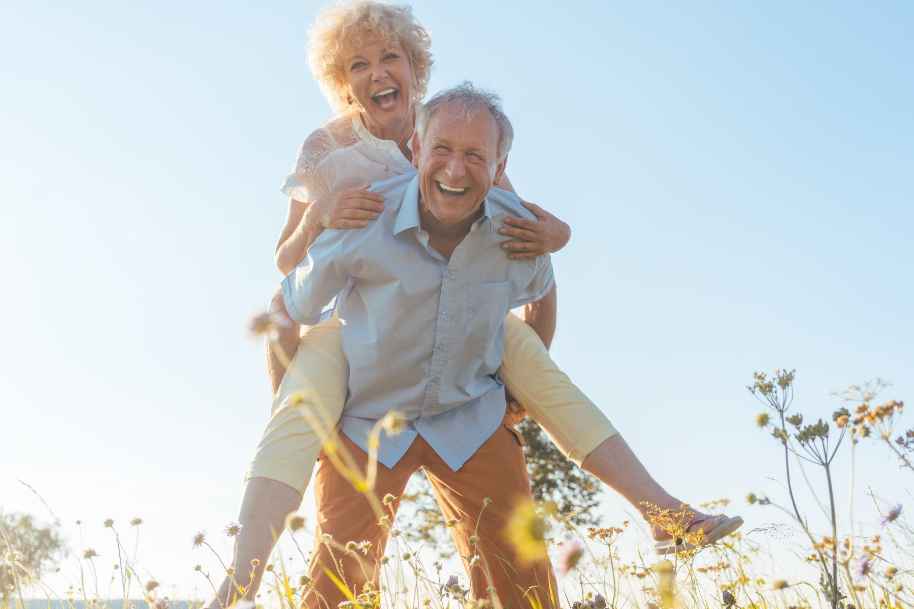 Couple is smiling and enjoying life out in nature. Acupuncture can help you take control of your life to live the life you love. Ari Acupuncture can help with pain management and many other health issues.